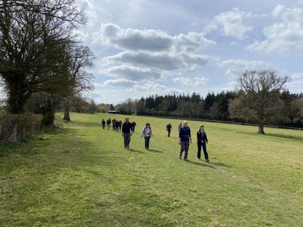 people walking down a valley